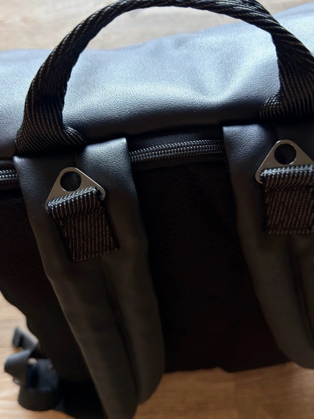 Black Quilted Roll-Top Backpack - [Brand]